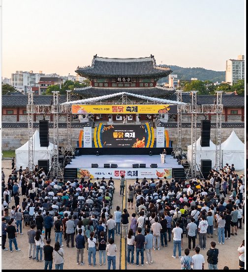 Hwaseong Haenggung palace and Hwaseong Fortress stone walls illuminated at night during the Suwon Tongdak Street Festival
